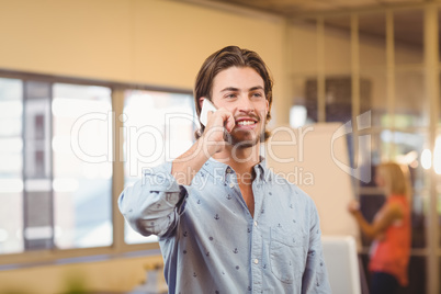 Confident businessman talking on phone