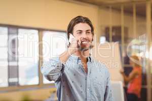 Confident businessman talking on phone