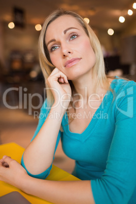 Thoughtful young woman in cafe