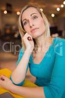 Thoughtful young woman in cafe