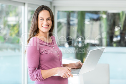 Portrait of businesswoman with laptop