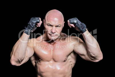 Portrait of bald man in gloves