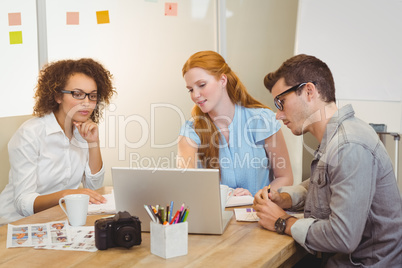 Colleagues in meeting with businesswoman
