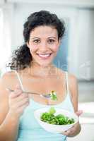 Portrait of woman with salad