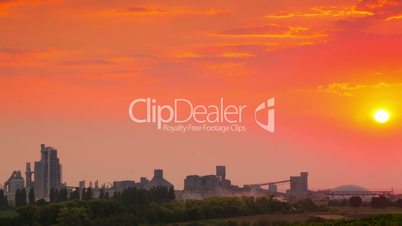 Sunset over Cement Plant. Time Lapse