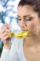 Peaceful woman drinking herbal tea