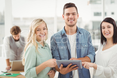 Portrait of happy Business professionals using digital tablet