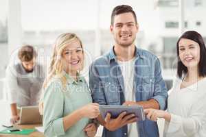 Portrait of happy Business professionals using digital tablet