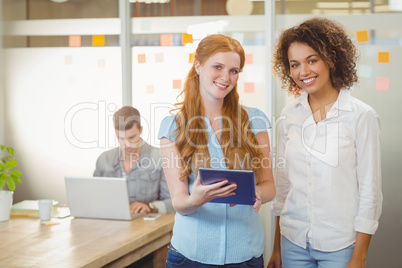 Portrait of businesswomen using digital PC