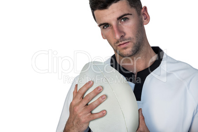 Portrait of rugby player holding ball