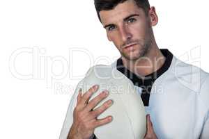 Portrait of rugby player holding ball
