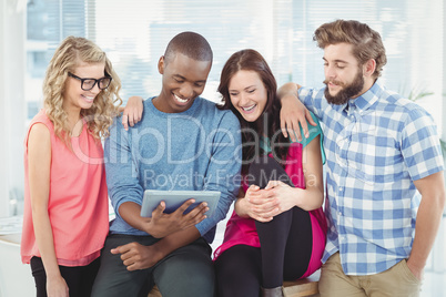 Happy Business professionals using tablet