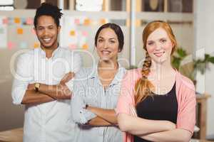 Business people with arms crossed in office