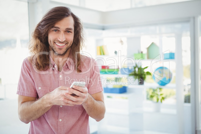 Portrait of cheerful hipster using mobile phone Portrait of cheerful hipster using mobile phone