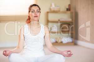 Calm woman in yoga pose with eyes closed