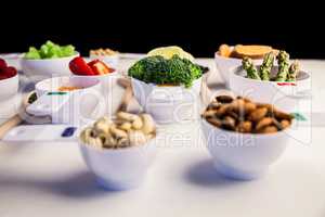 Portion cups and spoons of healthy ingredients