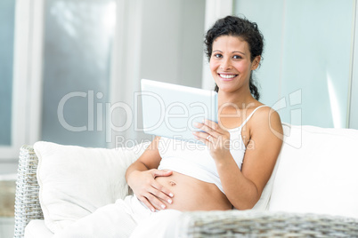 Portrait of happy woman with tablet