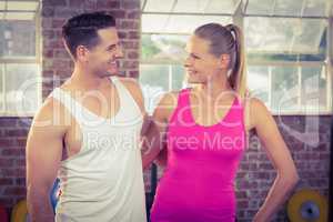Fit smiling couple in crossfit