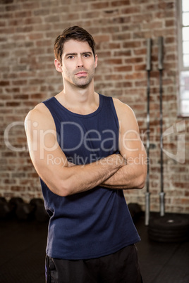 Portrait of serious man with arms crossed