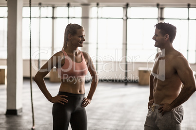 A muscular couple discussing together