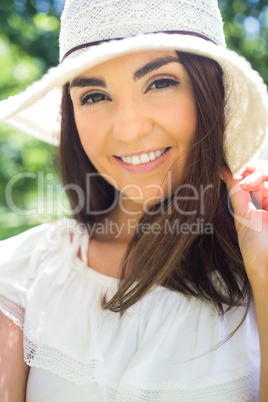 Portrait of happy woman in sun hat