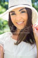 Portrait of happy woman in sun hat