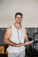 Portrait of instructor holding clipboard