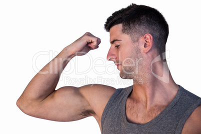 Handsome man showing biceps