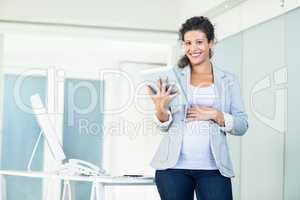 Smiling beautiful businesswoman using digital tablet