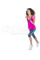 Determined young woman jogging