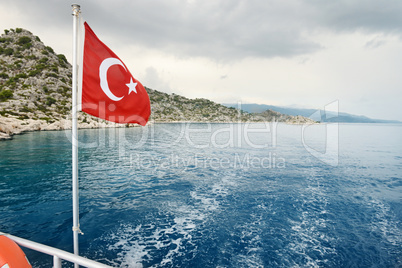 Turkish flag on a background of sea and sky