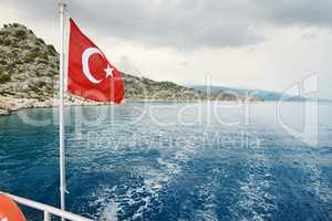 Turkish flag on a background of sea and sky