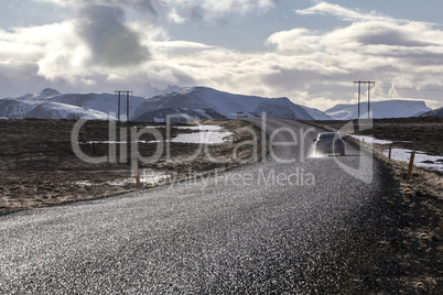 Snowy volcano landscape with dramatic clouds in Iceland