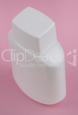 perfumery bottle on pink background