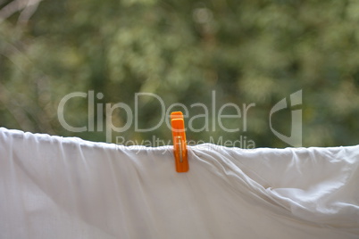 clothespin on white bedsheet