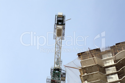 house develop with crane at day
