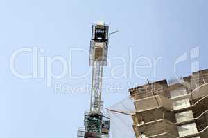 house develop with crane at day
