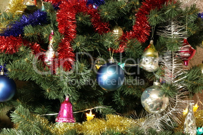 many of toys on green christmas fir