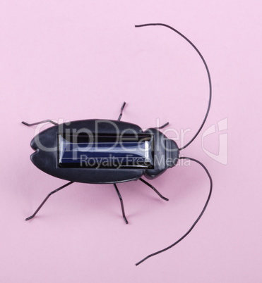 Electronic Bug Toy on Pink Background