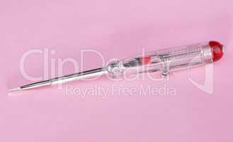 electric indicating screwdriver on pink background