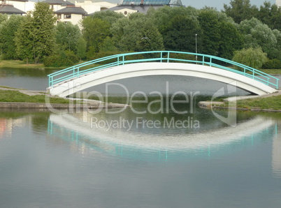 bridge over pond in city park