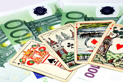 euros banknote with playing card