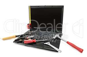 Computer repair with set of tools.
