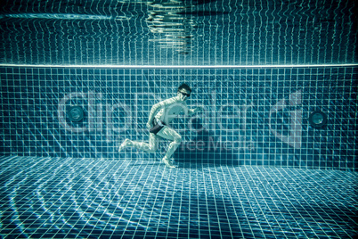 Man runs underwater swimming pool