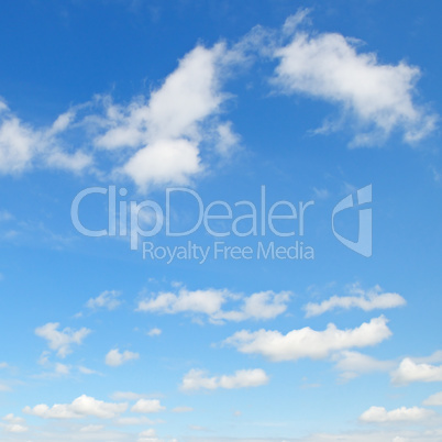 light cumulus clouds in the blue sky