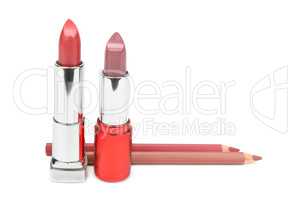 lipsticks and cosmetic pencils isolated on a white background