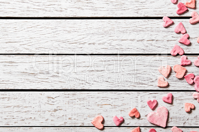 Holiday background with heap of small hearts
