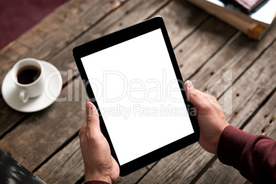 Man holds digital tablet computer in his hands