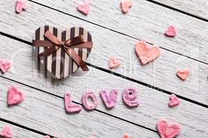 Word Love with heart shaped gift box