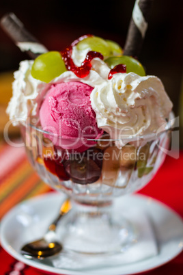 Delicious vanilla sundae with strawberry